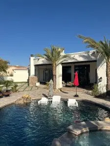 Exterior house painting with poolside view in Scottsdale, AZ