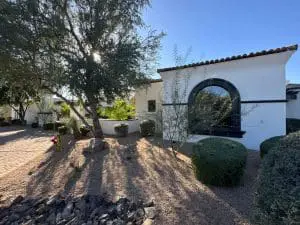 Fresh exterior paint on white stucco home with black trim in Paradise Valley, AZ