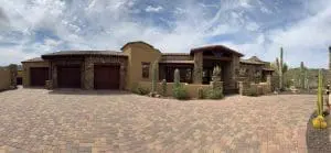 Custom desert-style entry courtyard with painted stucco and stone accents in Cave Creek, AZ