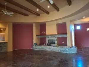 In-progress interior painting with bold accent walls in Scottsdale living room with fireplace