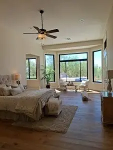Fresh interior paint in spacious Scottsdale bedroom with large bay windows and natural light